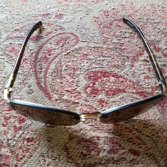 PRADA Sunglasses Model:PRADA SPR 10B Frame Color:Brushed Matte Silver Tortoise - Picture 9 of 13